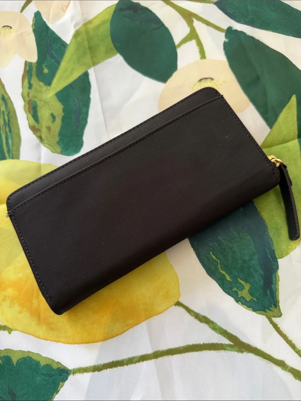 kate spade black zip-around wallet with gold plaque